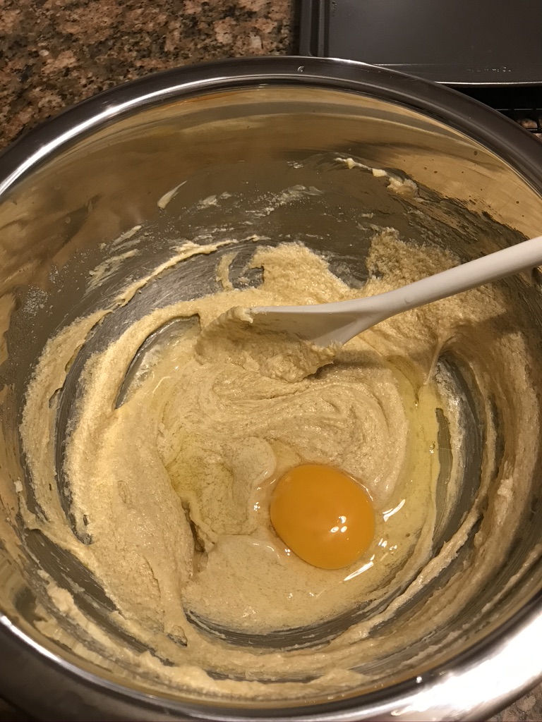 Add in eggs to creamed butter